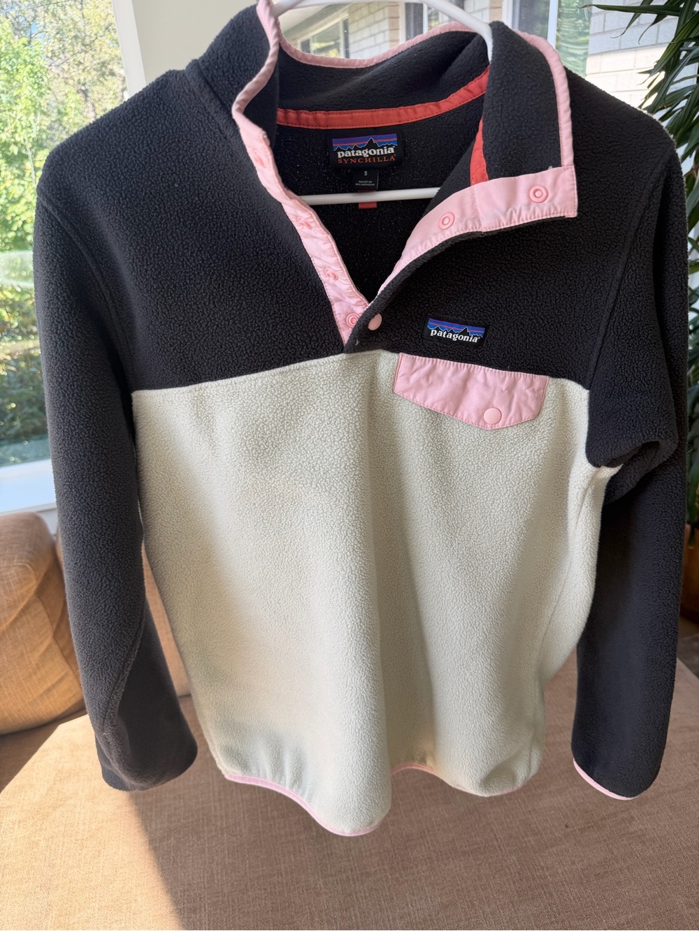 Patagonia women's black, cream, and pink Synchilla snap pullover